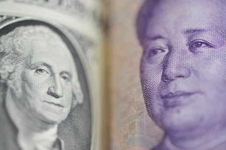 Hamburg, Germany - November 9, 2018: close up of a Dollar and a Yuan banknote - symbolizes the trade...