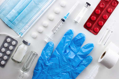 Various medical equipment, ampoules, drugs, tablets, capsules, spray, patch, syringe, vials on a white background. Medicine, pharmacy, hospital, treatment, pharmacy concept.の写真素材