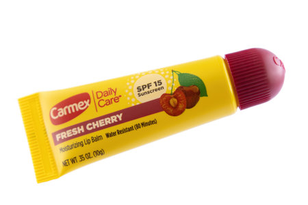 Carmex brand cherry flavored moisturizing lip balm isolated on white backgroundのeditorial素材