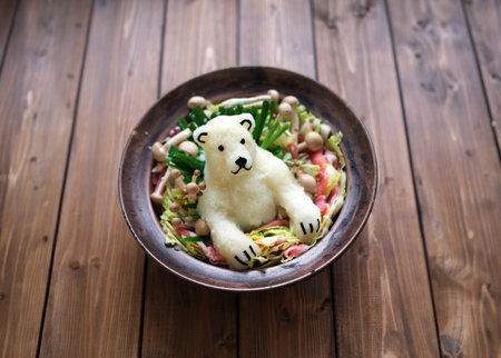 Salad in the form of a polar bear on a wooden backgroundの写真素材