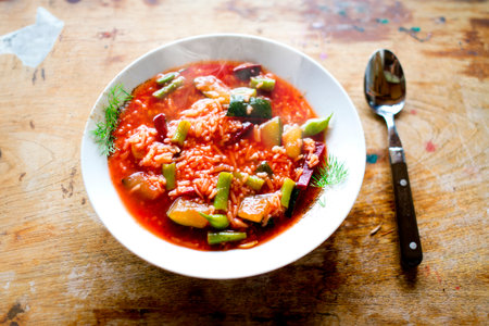 Tom yum kung - Thai spicy soup with red fish and vegetablesの写真素材