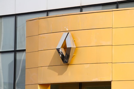 Kazan, Russian Federation - Jun 5, 2018: Renault dealership sign against blue sky. Renault is known for its role in motor sport, particularly rallying, Formula 1 and Formula E.のeditorial素材