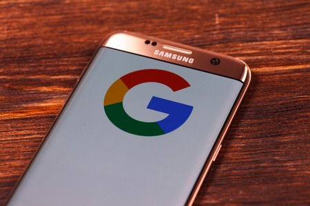 Kazan, Russian Federation - Aug 5, 2018: Google logo on smartphone screen. Google is an American technology and online services company. Illustrative editorial.のeditorial素材