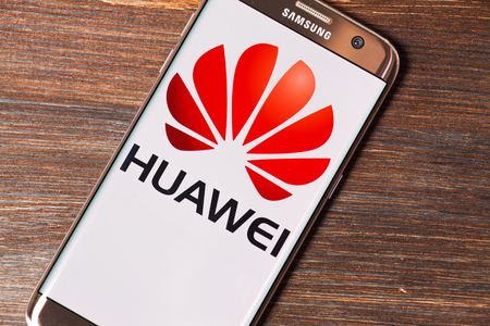 Kazan, Russian Federation - Aug 5, 2018: Huawei logo on screen of Huawei P9 lite. Huawei Technologies Co., Ltd. is a Chinese multinational networking and telecommunications equipment and services company.のeditorial素材