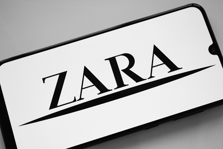 Russia, Kazan May 1 2019: Clothing store Zara. Zara logo on smartphone screen on white backgroundのeditorial素材