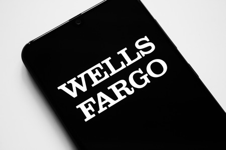 RUSSIA, KAZAN MAY 1, 2019: Wells Fargo black logo on a white background on a smartphone screenのeditorial素材
