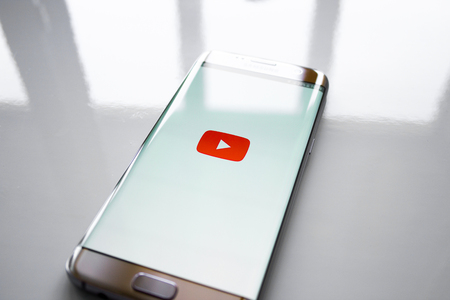 Kazan, Russian Federation - Jun 15, 2018: YouTube application on screen of modern smartphone.のeditorial素材