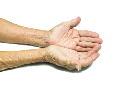Asian Senior woman's hand isolated on white backgroundの写真素材