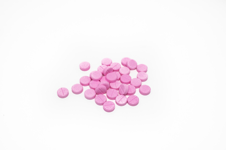 Pink Pills isolated on white background.の写真素材