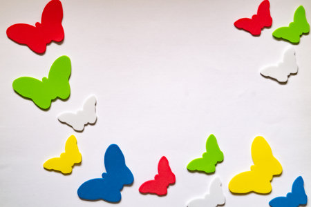Multicolored paper butterflies on a white background. copyspace.の写真素材