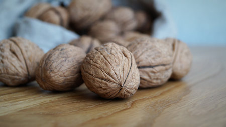 Walnuts on a wooden table. Selective focus and shallow depth of field.