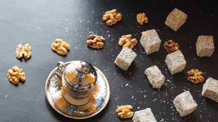 Turkish delight with walnuts on a black background. Selective focus.の写真素材