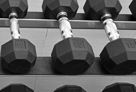 Dumbbells on rack in gymの写真素材