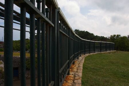A metallic fence in the parkの写真素材