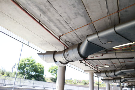 Underground car park of a shopping center with columns and ventilation ductsの写真素材