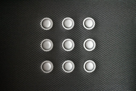 Close up of a cloth seat sports car similar to carbon fiber