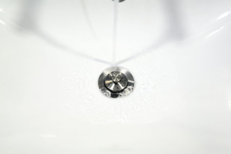 Washbasin tap with stainless steel waste