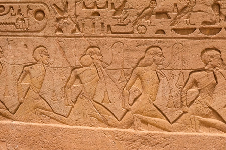 Egyptian hieroglyphs and drawings on the walls and columns. Egyptian language, The life of ancient...