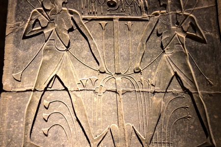 Egyptian hieroglyphs and drawings on the walls and columns. Egyptian language, The life of ancient gods and people in hieroglyphics and drawingsの写真素材