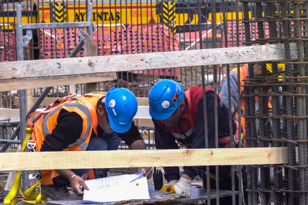 Moscow, Russia - May 22, 2018: Workers in helmets on the construction site. Construction works