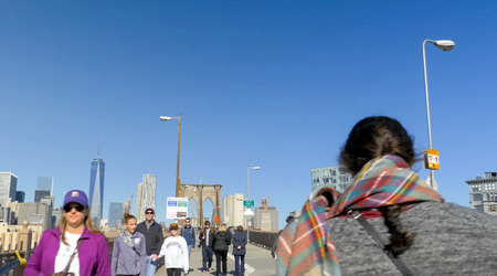 New York, USA - June 20, 2015: The Brooklyn Bridge. Walk on the bridge. Walking through the streets of New York, Manhattan. The life of New York in the afternoon. Streets and city buildings.のeditorial素材