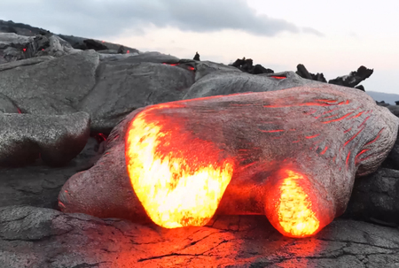 Pouring lava on the slope of the volcano. Volcanic eruption and magmaの写真素材