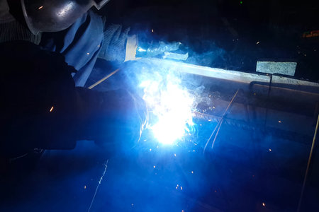 Welding of steel reinforcement. Sparks and light from welding. Electric welding.
