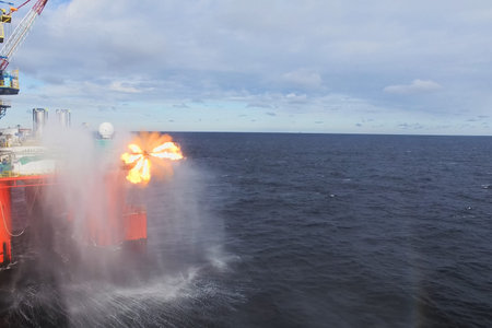 Oil offshore platform in the sea. Extraction of oil on the shelf.