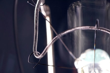 Tungsten filament in an incandescent lamp, macro photoの写真素材