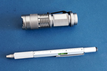 Products from aluminum, a flashlight and a writing pen.