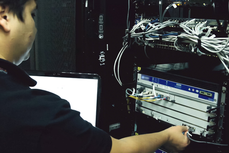 Arkhangelsk, Russia - December 27, 2017: The system administrator is debugging server hardwareのeditorial素材
