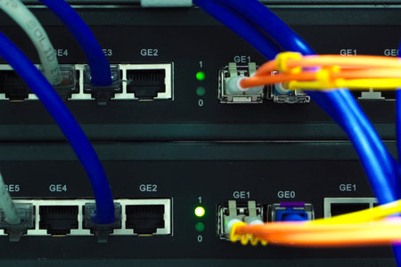 A working server. Internet wires and flashing lights on the server.