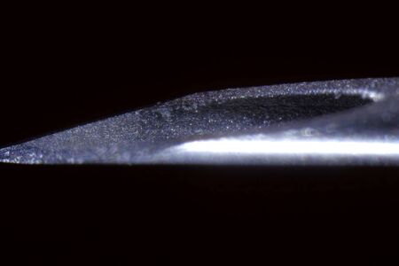 The end of the needle of a medical syringe. Macro shot of a syringe needle.の写真素材