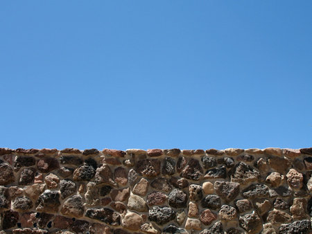Sky view above stone wallの写真素材