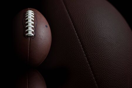 Football & reflection on blackの写真素材