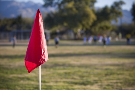 Red flag on soccer fieldの写真素材