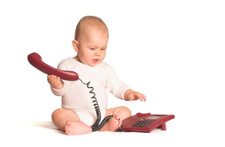Connecting other people is easy today when the whole world is wired in. Even a baby can do it!の写真素材