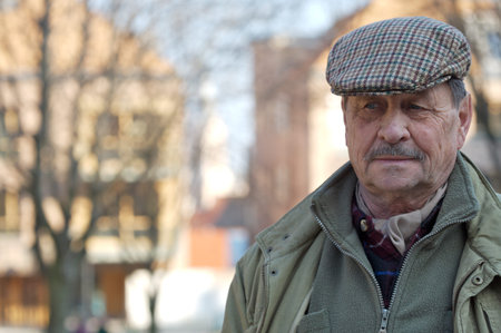 Outdoor portrait of a senior man, europian style.の写真素材
