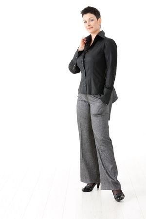 Portrait of happy young businesswoman, smiling, isolated on white background.の写真素材