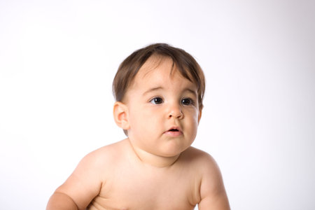 Portrait of cute baby wearing diaper - white background.の写真素材