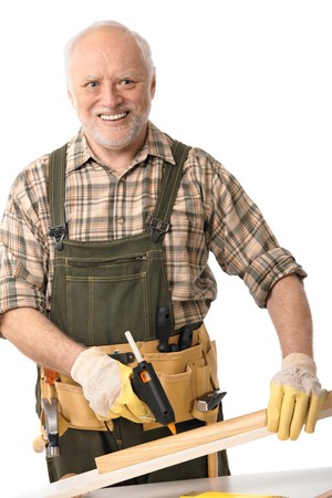 Happy senior man working with tools, cutout.
の写真素材