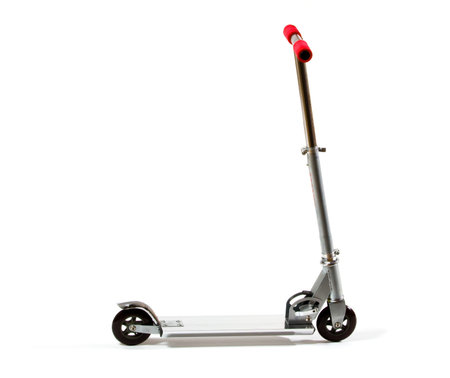 Tudio shot of metal toy scooter, isolated on white.