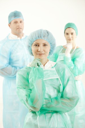 Confident hospital crew smiling at camera, wearing scrubs, smiling.の写真素材