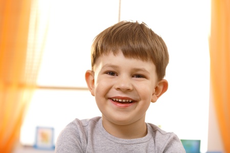 Portrait of adorable small boy looking at camera.の写真素材