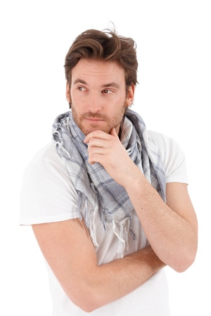 Portrait of handsome trendy young man looking away, thinking, isolated on white background.の写真素材