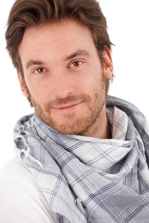 Closeup portrait of handsome young man, looking at camera, smiling.の写真素材