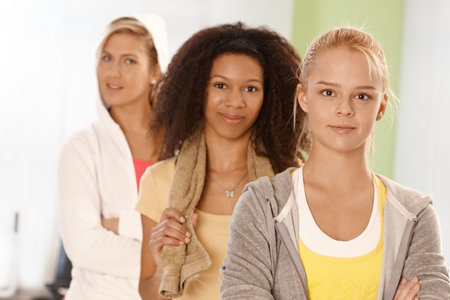 Portrait of three fit girls in sportswear.の写真素材