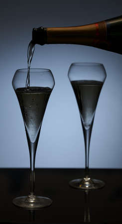 Elegant photo of a champagne flute on dark background.の写真素材