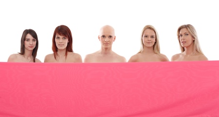 Young women behind pink textile. 
This is a free image, part of a charity project. Models and the staff worked for free to support breast cancer awereness campaigns worldwide.の写真素材