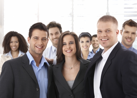 Team portrait of group of happy successful business people smiling.の写真素材